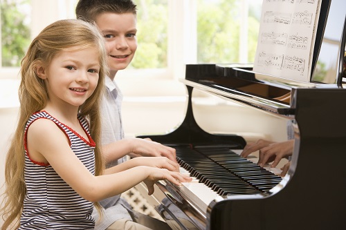 Kids Enjoying Playing Piano